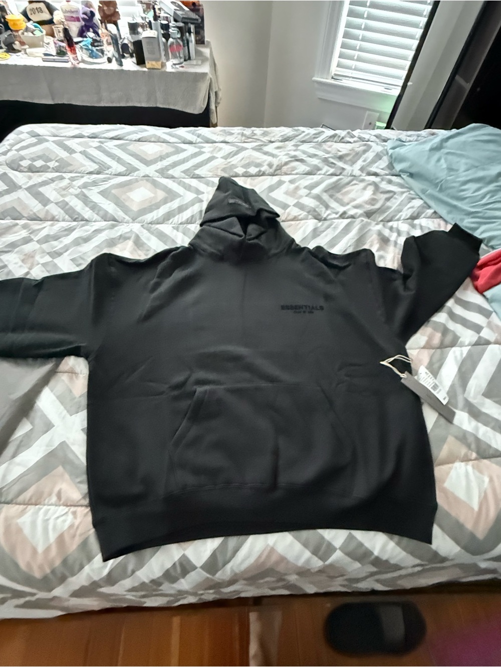 Essentials Stretch Lim Black Pullover Hoodie with Subtle Tag
